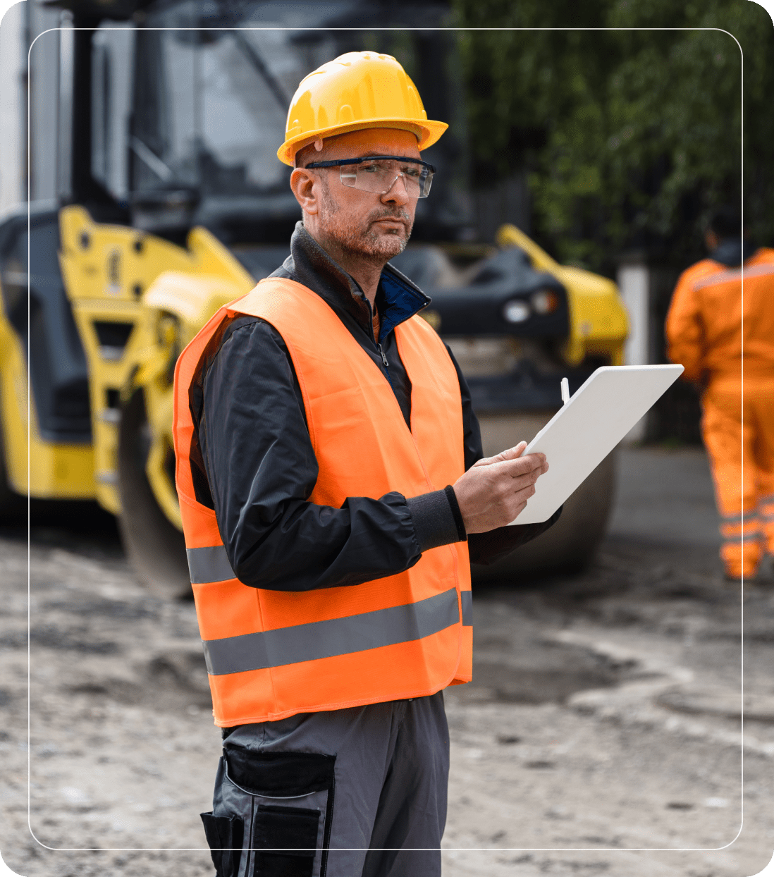 Construction worker with clipboard and safety gear.